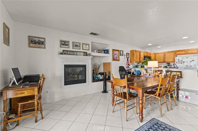 1509 Trinette Dr, Beaumont, CA 92223 - dining space with recessed lighting, a tiled fireplace, light tile patterned floors, and visible vents