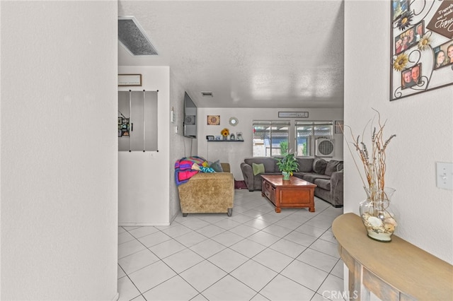 1509 Trinette Dr, Beaumont, CA 92223 - living area with light tile patterned floors, visible vents, and a textured ceiling
