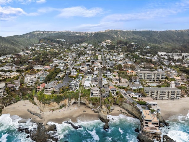 drone / aerial view featuring a water and mountain view