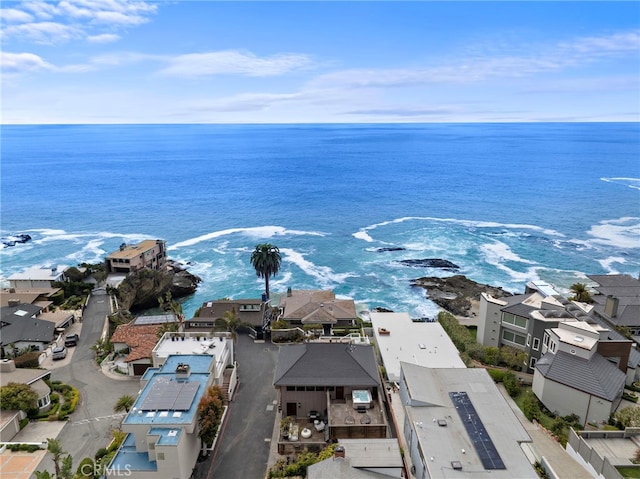 bird's eye view featuring a water view and a residential view