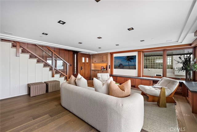 living room with stairs and wood finished floors