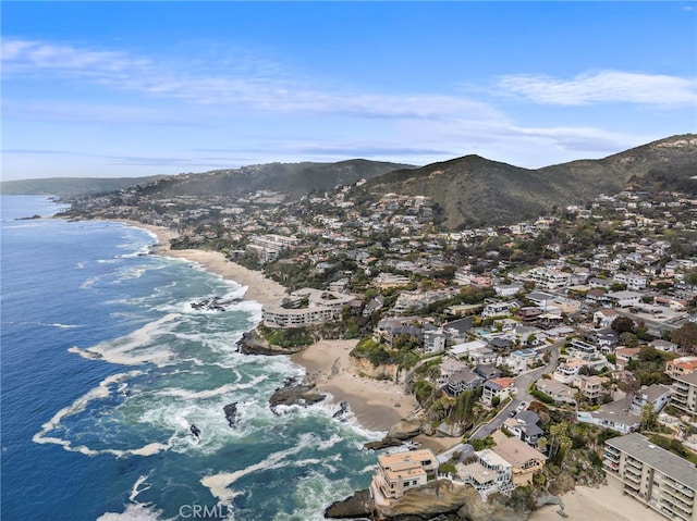 bird's eye view featuring a view of the beach and a water and mountain view