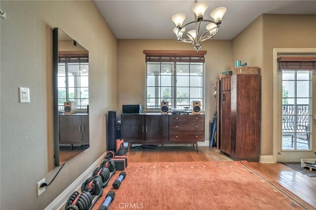 4805 Bellflower Ave Unit 205, North Hollywood, CA 91601 - interior space with plenty of natural light, wood finished floors, and a notable chandelier