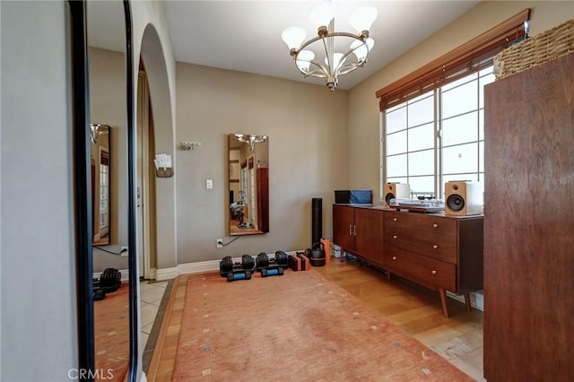 4805 Bellflower Ave Unit 205, North Hollywood, CA 91601 - workout room with arched walkways, a chandelier, and baseboards