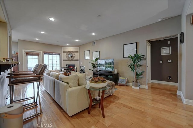 4805 Bellflower Ave Unit 205, North Hollywood, CA 91601 - living area with recessed lighting, visible vents, light wood finished floors, and baseboards