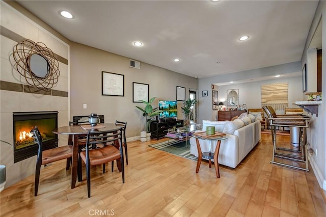4805 Bellflower Ave Unit 205, North Hollywood, CA 91601 - living area featuring recessed lighting, a tiled fireplace, visible vents, and light wood-style flooring