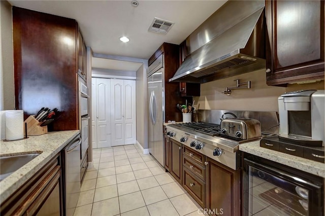 4805 Bellflower Ave Unit 205, North Hollywood, CA 91601 - kitchen with wine cooler, wall chimney range hood, visible vents, light tile patterned flooring, and appliances with stainless steel finishes