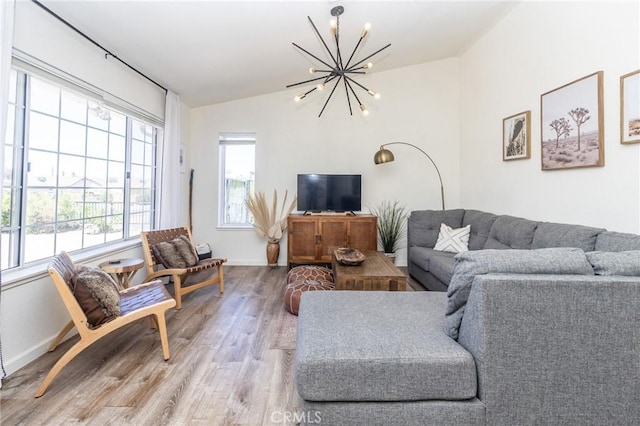 1929 Casa Linda St, Needles, CA 92363 - living area featuring baseboards, a chandelier, wood finished floors, and lofted ceiling