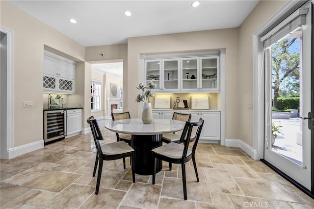 1489 Caballero Rd, Arcadia, CA 91006 - dining area featuring beverage cooler, stone tile flooring, healthy amount of natural light, and recessed lighting