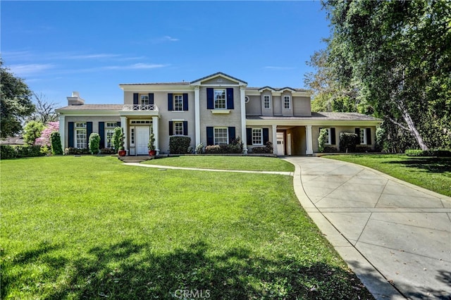 1489 Caballero Rd, Arcadia, CA 91006 - neoclassical home featuring concrete driveway, a front yard, a chimney, and stucco siding