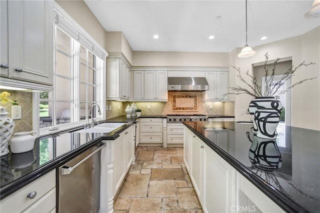 1489 Caballero Rd, Arcadia, CA 91006 - kitchen with wall chimney range hood, stone tile floors, stainless steel appliances, dark countertops, and decorative backsplash