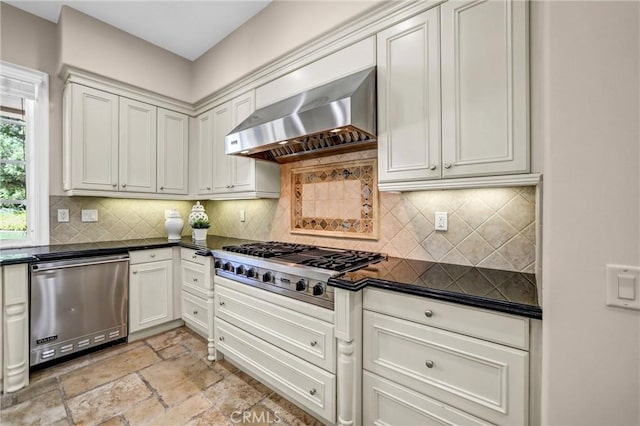 1489 Caballero Rd, Arcadia, CA 91006 - kitchen with stainless steel appliances, wall chimney range hood, dark countertops, decorative backsplash, and stone tile floors