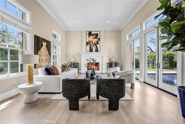 1489 Caballero Rd, Arcadia, CA 91006 - living area featuring plenty of natural light, wood finished floors, a lit fireplace, ornamental molding, and recessed lighting