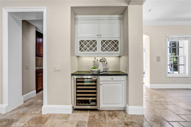 1489 Caballero Rd, Arcadia, CA 91006 - indoor dry bar with wine cooler, stone tile flooring, and crown molding