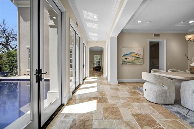 1489 Caballero Rd, Arcadia, CA 91006 - hall featuring french doors, stone tile floors, arched walkways, recessed lighting, and crown molding