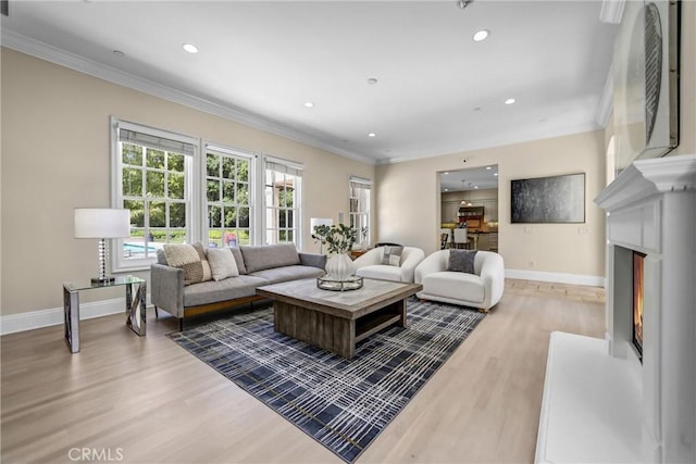 1489 Caballero Rd, Arcadia, CA 91006 - living room with light wood-style flooring, crown molding, recessed lighting, and a lit fireplace