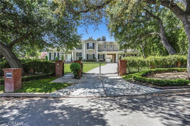 1489 Caballero Rd, Arcadia, CA 91006 - view of front facade featuring a gate, a fenced front yard, and concrete driveway