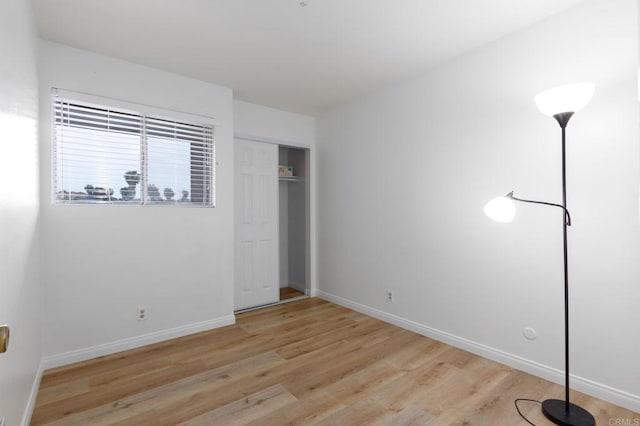992 Churrituck Dr, San Diego, CA 92154 - unfurnished bedroom with baseboards, light wood-style flooring, and a closet