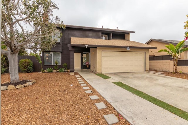 992 Churrituck Dr, San Diego, CA 92154 - view of front of house featuring stucco siding, fence, driveway, and a garage