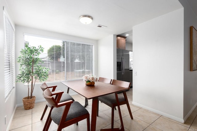 992 Churrituck Dr, San Diego, CA 92154 - dining room with baseboards, visible vents, and light tile patterned floors