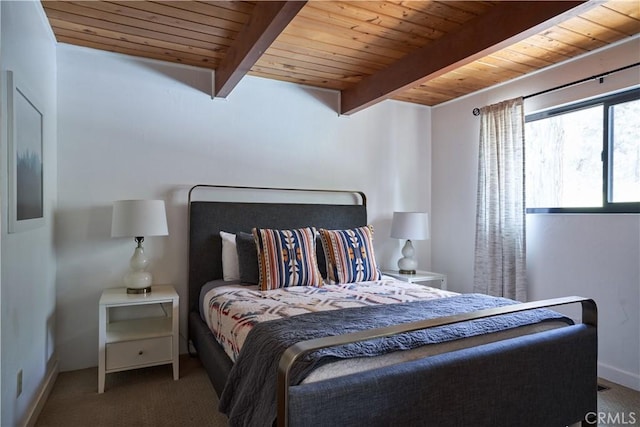 carpeted bedroom with wood ceiling, baseboards, and beam ceiling