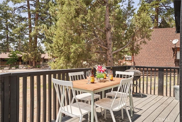 deck with outdoor dining area