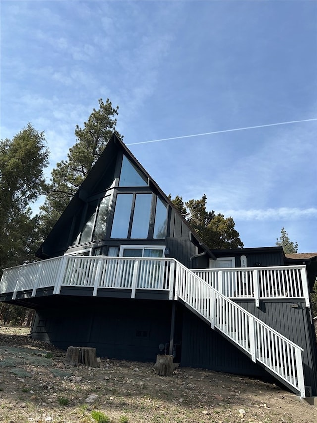 rear view of house with a deck