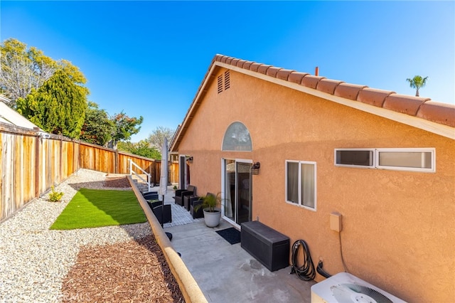 27263 Family Cir, Menifee, CA 92586 - back of house with a patio area, a fenced backyard, central air condition unit, and stucco siding