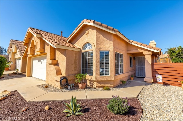 27263 Family Cir, Menifee, CA 92586 - view of front of property with an attached garage, stucco siding, fence, and a tile roof