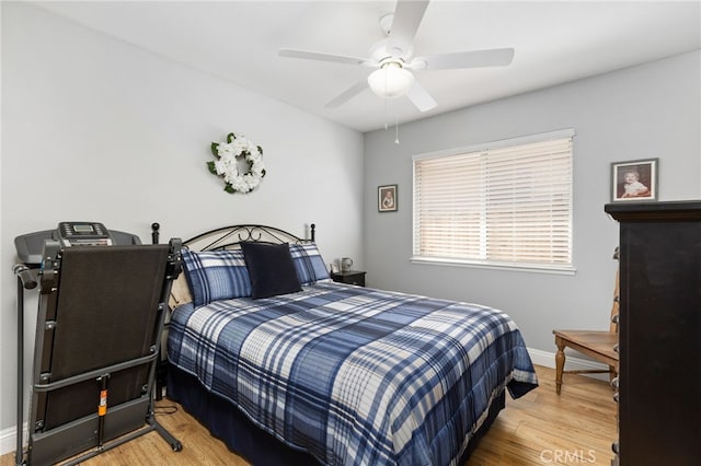 27263 Family Cir, Menifee, CA 92586 - bedroom featuring baseboards, a ceiling fan, and wood finished floors