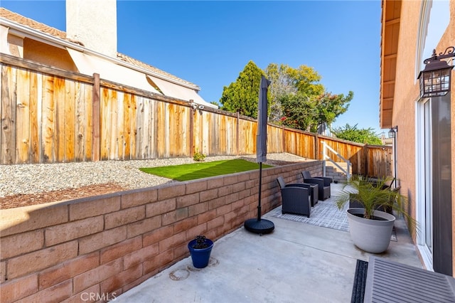 27263 Family Cir, Menifee, CA 92586 - view of patio featuring a fenced backyard
