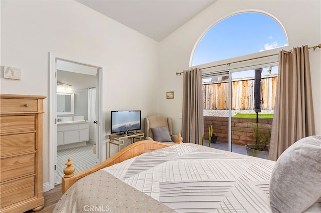 27263 Family Cir, Menifee, CA 92586 - bedroom with ensuite bathroom, high vaulted ceiling, access to outside, and wood finished floors