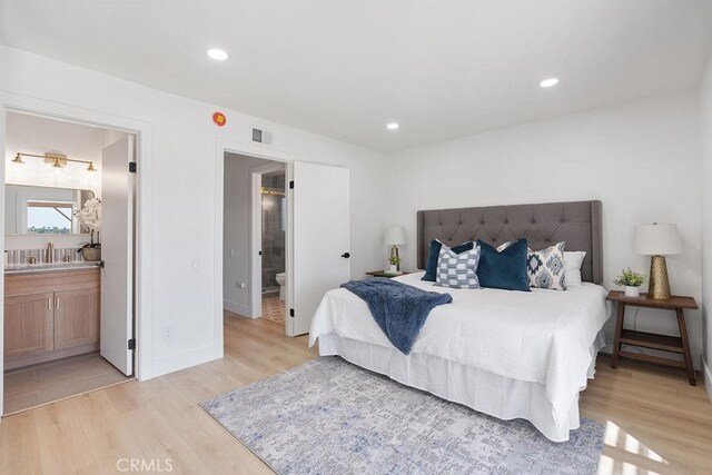 28116 Calle Casal, Mission Viejo, CA 92692 - bedroom featuring a sink, recessed lighting, ensuite bath, and light wood-style floors