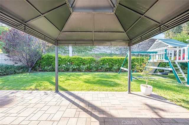 view of patio / terrace featuring a gazebo and a playground