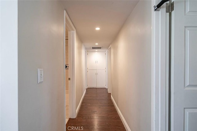 corridor with recessed lighting, baseboards, dark wood-style floors, and visible vents
