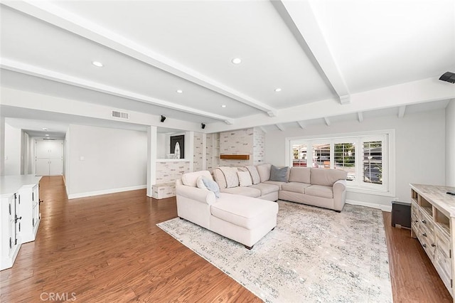 living room featuring visible vents, recessed lighting, baseboards, and wood finished floors