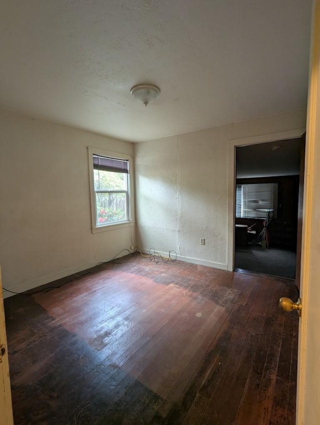 548 S Plumas St, Willows, CA 95988 - spare room with wood-type flooring and baseboards