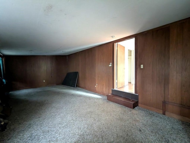 548 S Plumas St, Willows, CA 95988 - unfurnished living room featuring wood walls and carpet flooring