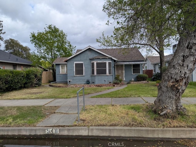 548 S Plumas St, Willows, CA 95988 - view of front of home with a front yard and fence