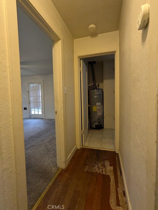 548 S Plumas St, Willows, CA 95988 - hall featuring gas water heater, hardwood / wood-style floors, and a textured wall