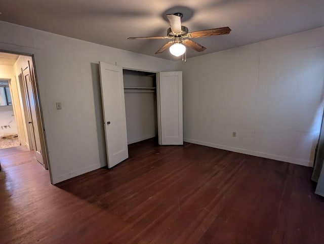 548 S Plumas St, Willows, CA 95988 - unfurnished bedroom featuring a closet, ceiling fan, baseboards, and dark wood-style floors