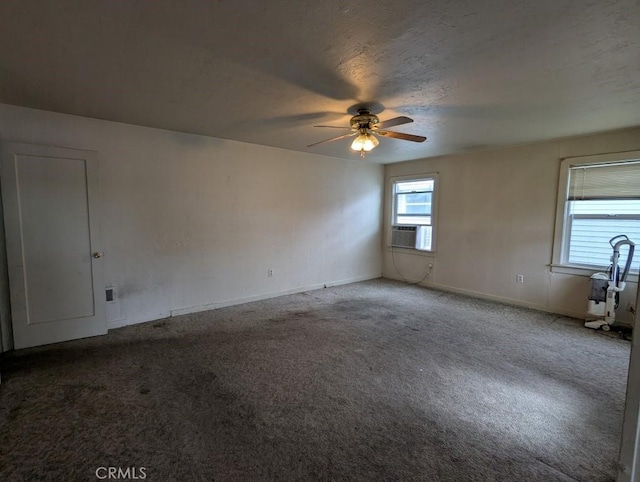 548 S Plumas St, Willows, CA 95988 - spare room featuring baseboards, carpet flooring, cooling unit, and a ceiling fan