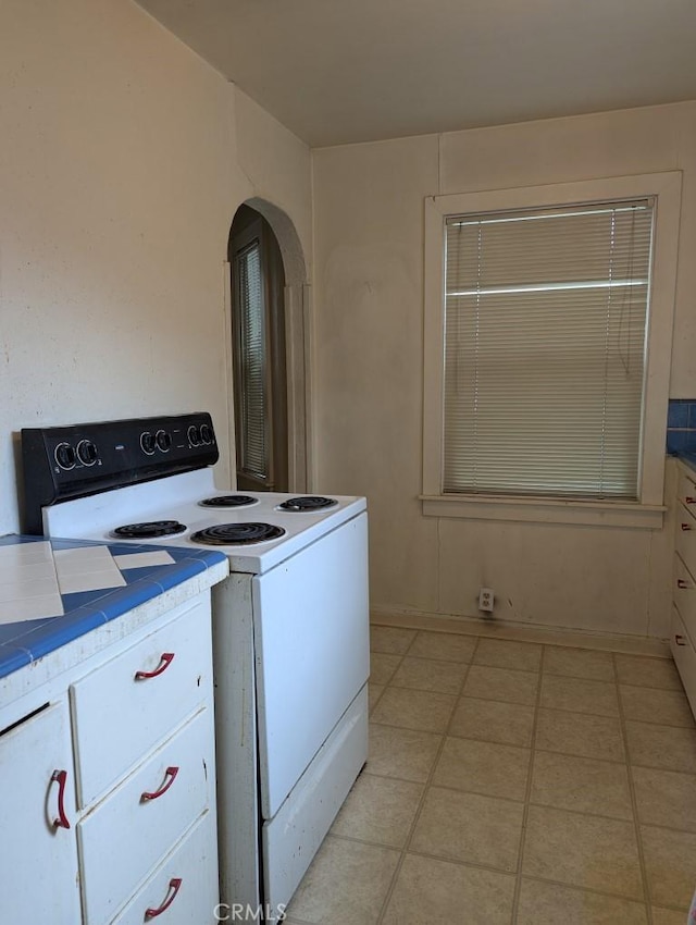 548 S Plumas St, Willows, CA 95988 - washroom featuring light tile patterned floors and arched walkways