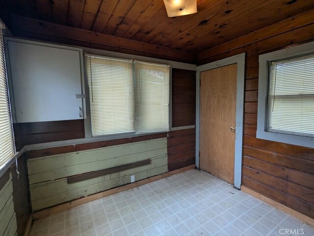 548 S Plumas St, Willows, CA 95988 - empty room featuring wooden walls, light floors, and wood ceiling
