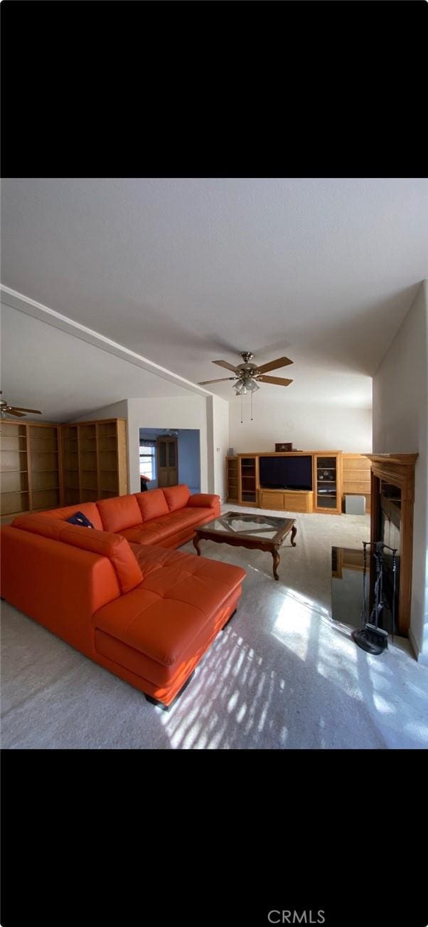6117 Juniper Rd, Lake Isabella, CA 93240 - carpeted living area with ceiling fan and a fireplace