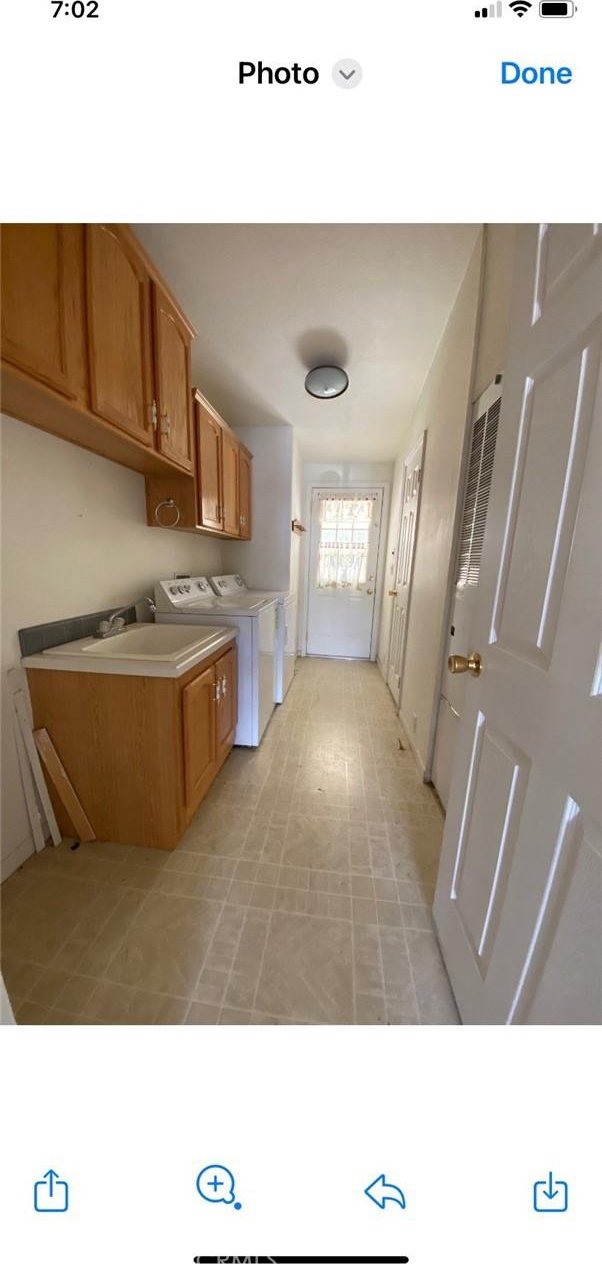 6117 Juniper Rd, Lake Isabella, CA 93240 - kitchen featuring separate washer and dryer, brown cabinetry, and light countertops
