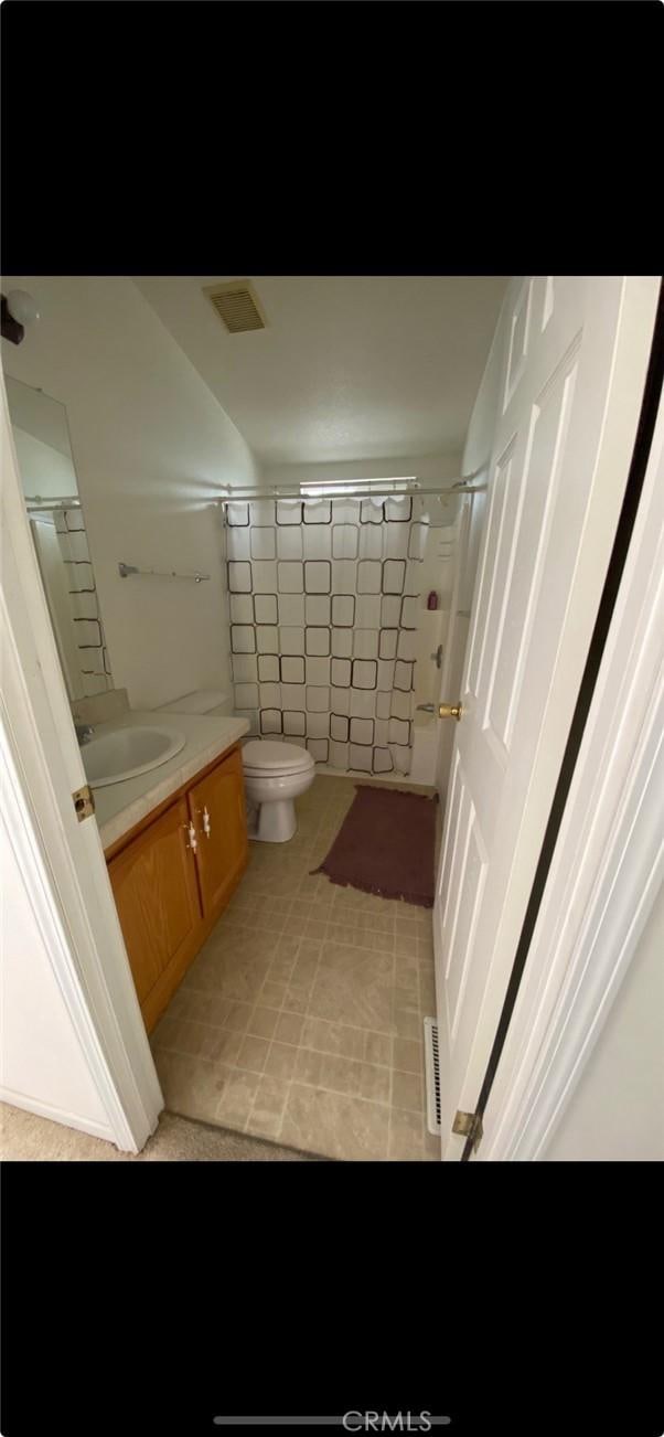 6117 Juniper Rd, Lake Isabella, CA 93240 - bathroom featuring vanity, toilet, a shower, and tile patterned flooring