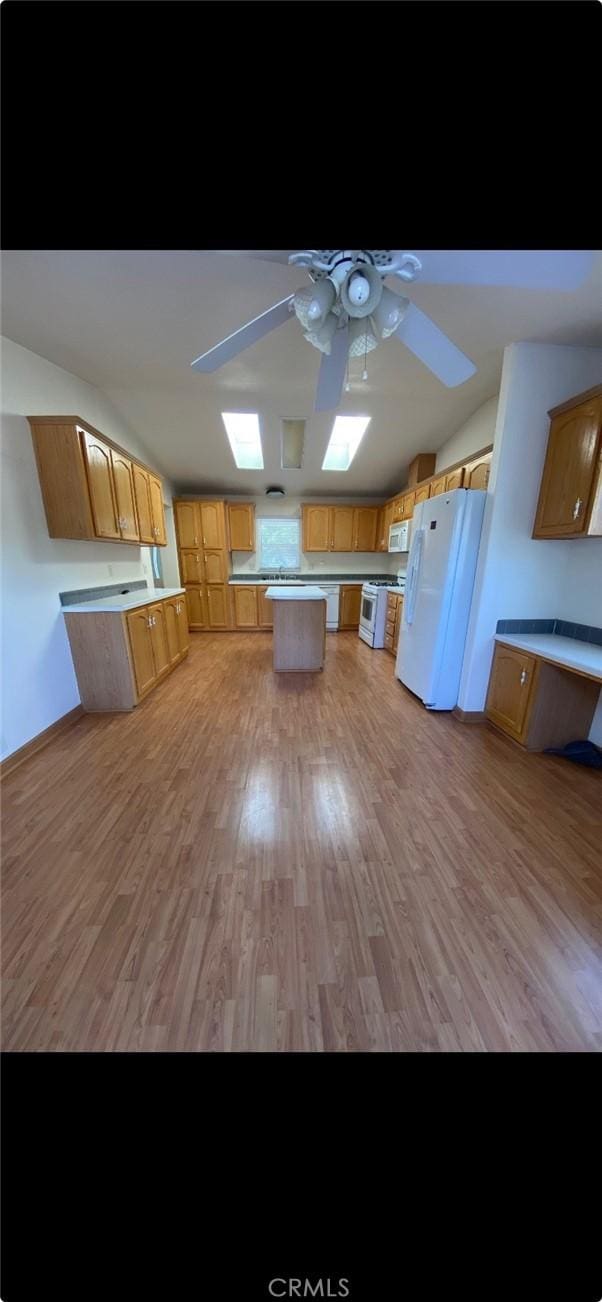 6117 Juniper Rd, Lake Isabella, CA 93240 - kitchen featuring a ceiling fan, white appliances, light wood-style floors, and light countertops