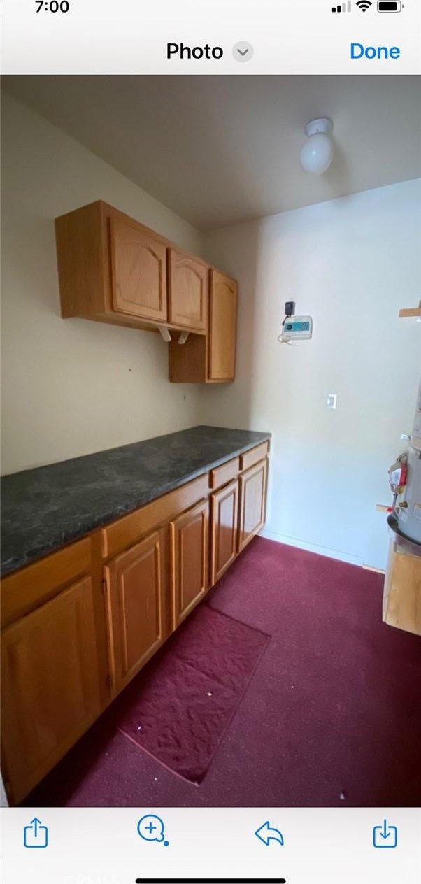 6117 Juniper Rd, Lake Isabella, CA 93240 - kitchen with dark colored carpet and dark countertops