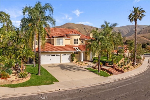 24240 Avenida De Marcia, Yorba Linda, CA 92887 - mediterranean / spanish house with driveway, a mountain view, stucco siding, and a tile roof